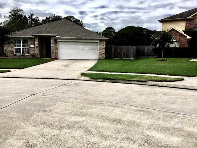 view of side of property featuring a yard and a garage