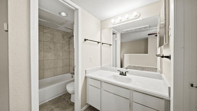 full bathroom featuring tub / shower combination, toilet, tile patterned flooring, and vanity