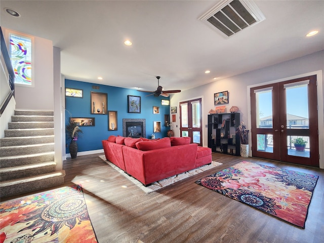 living room with french doors, dark wood-type flooring, and a healthy amount of sunlight