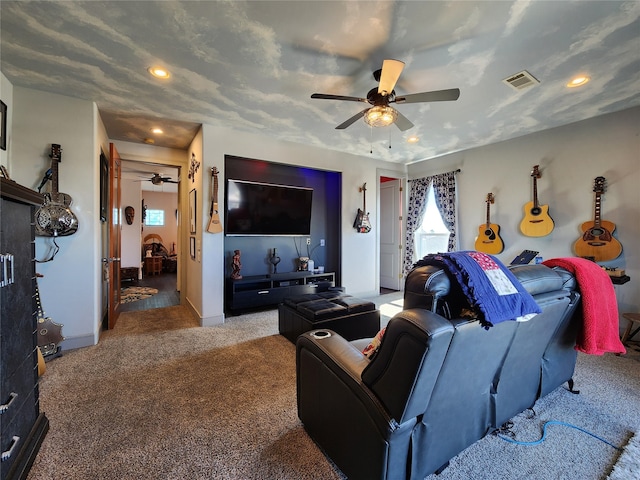 carpeted living room with ceiling fan