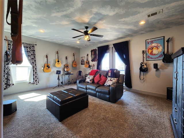 living room with carpet flooring and ceiling fan