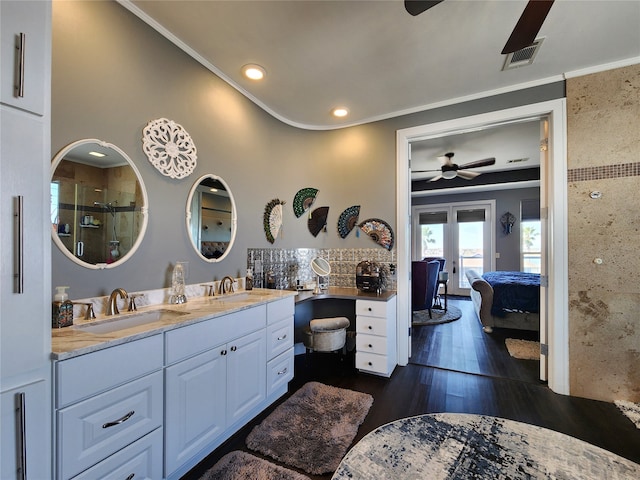 bathroom with vanity, a shower with door, french doors, crown molding, and hardwood / wood-style flooring