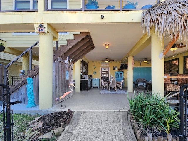 view of patio with area for grilling and ceiling fan