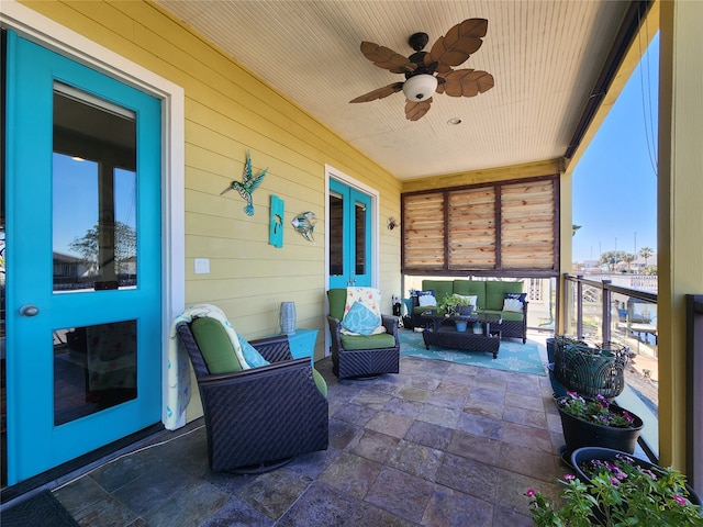 view of patio / terrace featuring ceiling fan, a balcony, and an outdoor hangout area