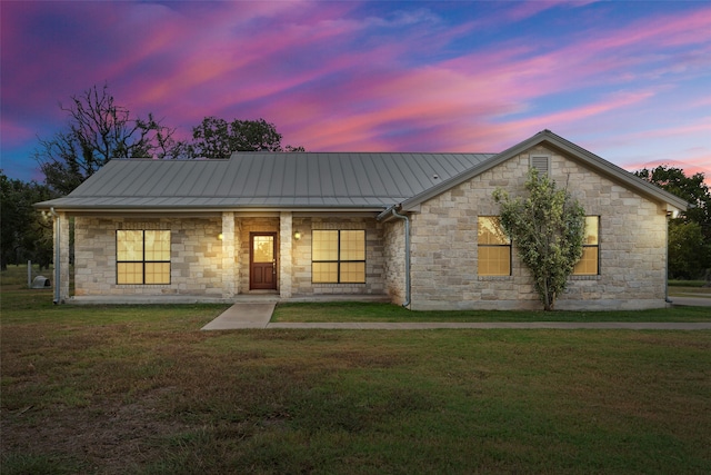 view of front of house with a lawn