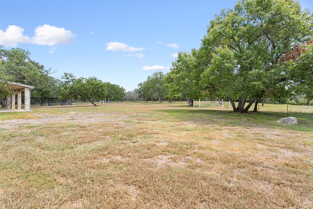 view of yard with a rural view