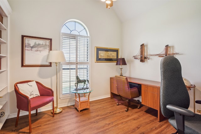 office space with vaulted ceiling, ceiling fan, and light hardwood / wood-style flooring