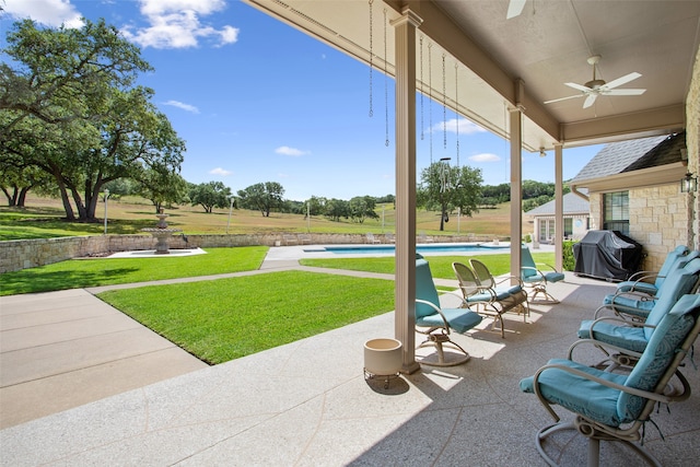 view of patio / terrace with ceiling fan and grilling area