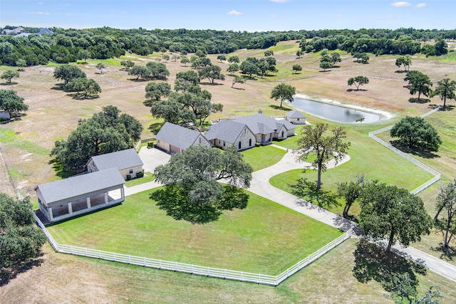 birds eye view of property featuring a rural view and a water view