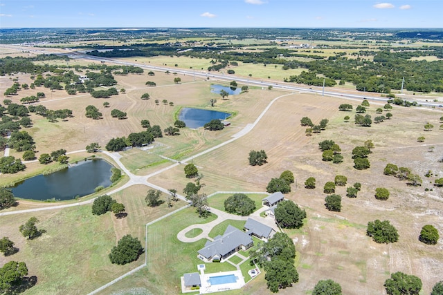 bird's eye view with a water view and a rural view