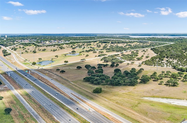 bird's eye view featuring a water view and a rural view