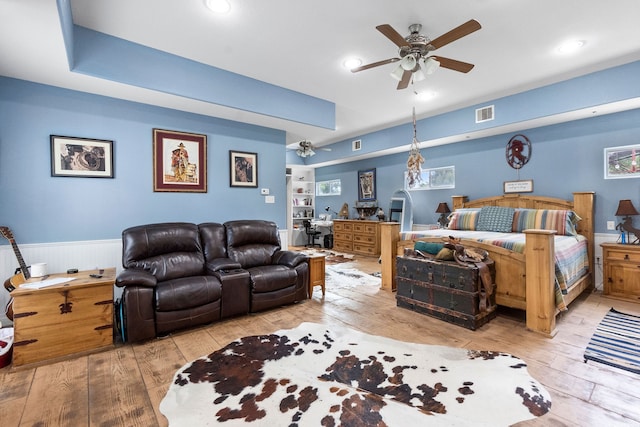 bedroom with ceiling fan and light hardwood / wood-style floors