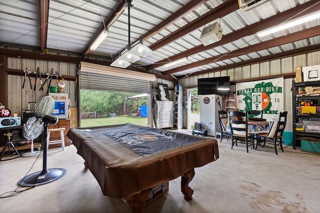 playroom featuring billiards, wooden walls, concrete flooring, and lofted ceiling with beams