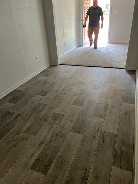 unfurnished room with dark hardwood / wood-style floors