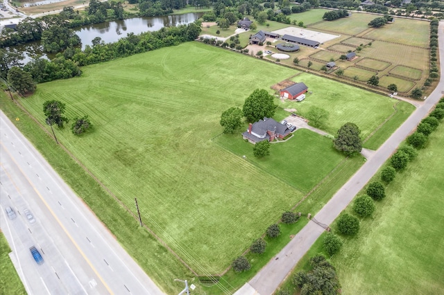 bird's eye view with a water view and a rural view