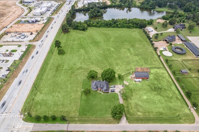 aerial view with a water view and a rural view