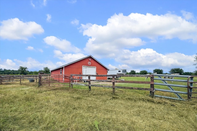 exterior space featuring an outdoor structure and a rural view