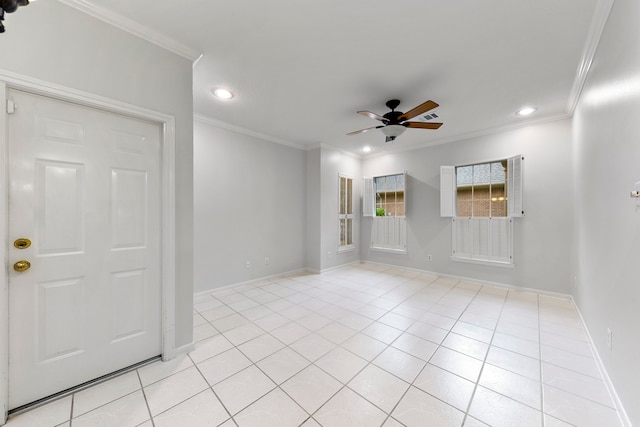 tiled spare room featuring crown molding and ceiling fan