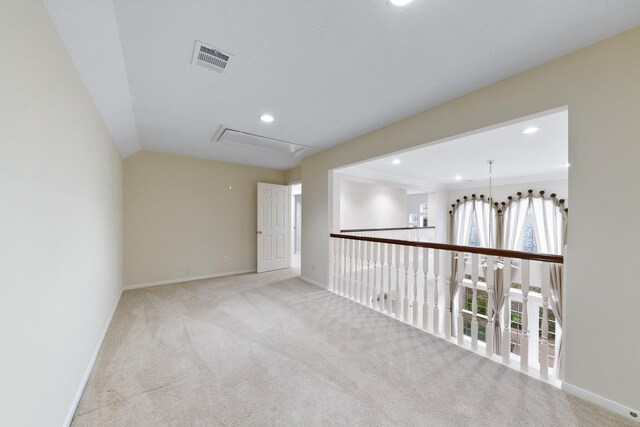 carpeted empty room featuring crown molding