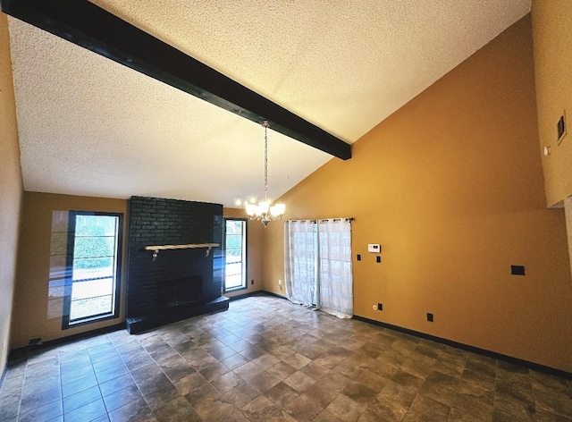 interior space featuring beam ceiling, a chandelier, a fireplace, a textured ceiling, and baseboards