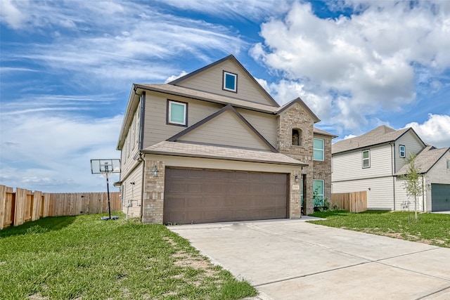 view of property with a garage and a front lawn