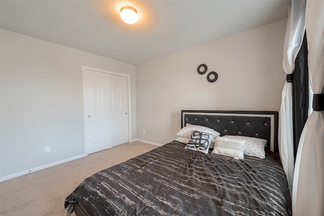 carpeted bedroom featuring a closet