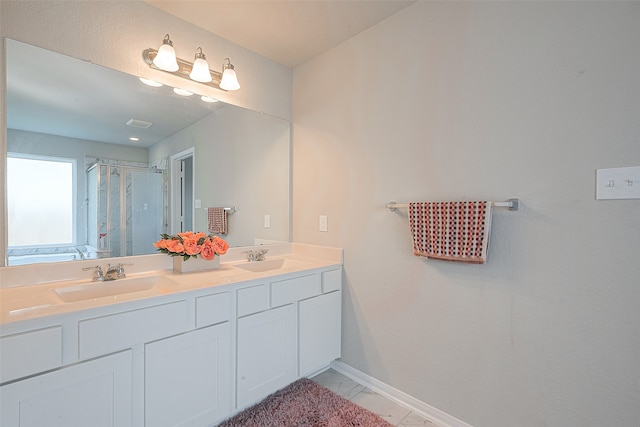 bathroom featuring vanity, an enclosed shower, and tile patterned floors