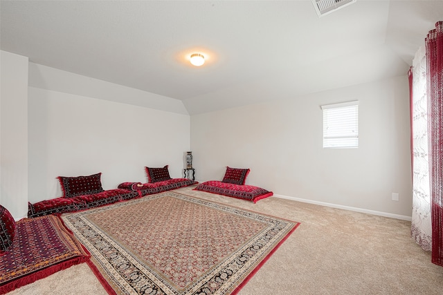 bedroom featuring lofted ceiling and carpet floors