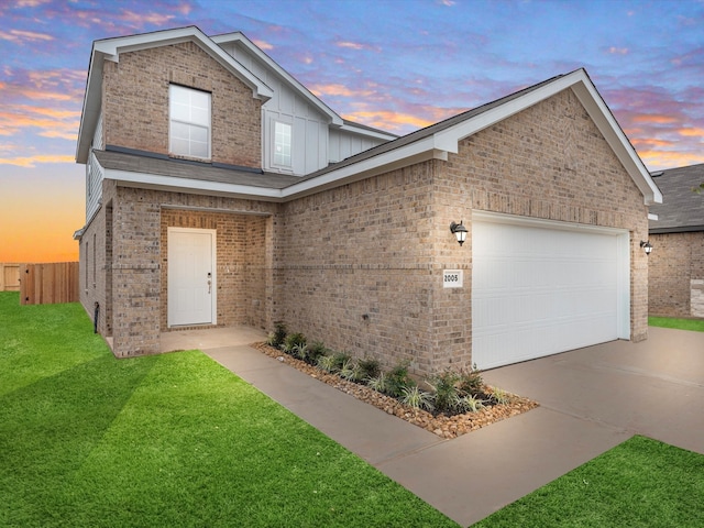 view of front facade featuring a yard and a garage