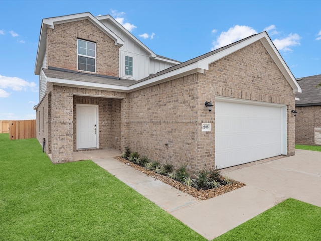 view of front of home with a front lawn and a garage