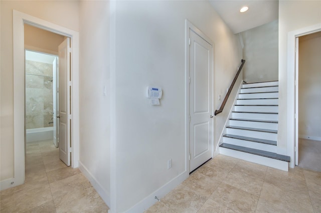 interior space featuring baseboards and recessed lighting