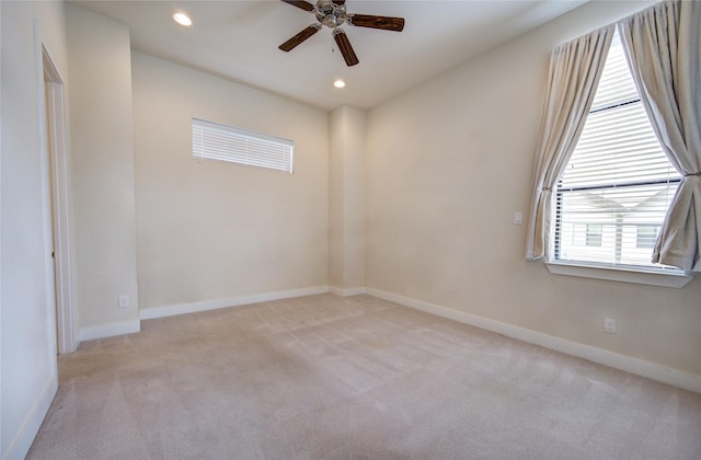 unfurnished room with light carpet, baseboards, and recessed lighting