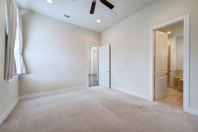 unfurnished bedroom featuring light carpet, baseboards, visible vents, and recessed lighting