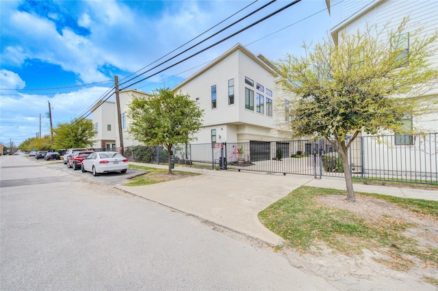 view of front of home featuring fence