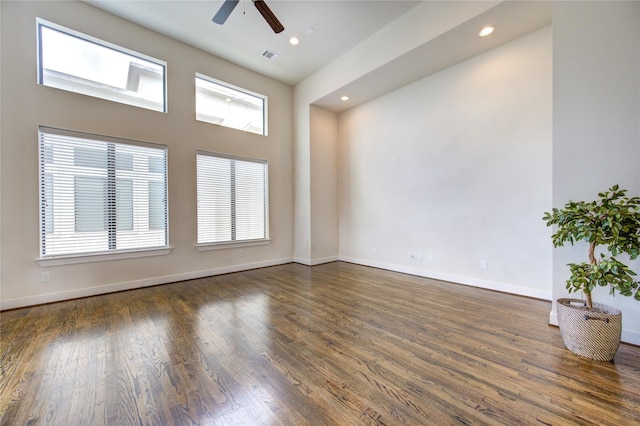 spare room with a ceiling fan, recessed lighting, baseboards, and wood finished floors