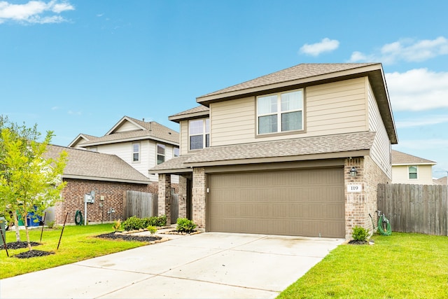 view of front facade featuring a garage and a front yard