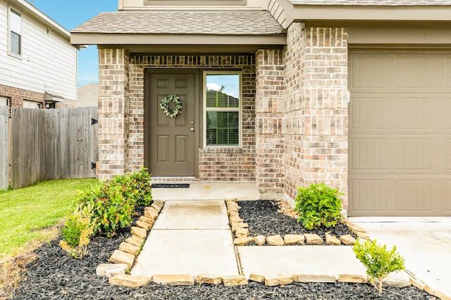 doorway to property featuring a garage