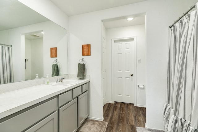 bathroom with vanity and wood-type flooring