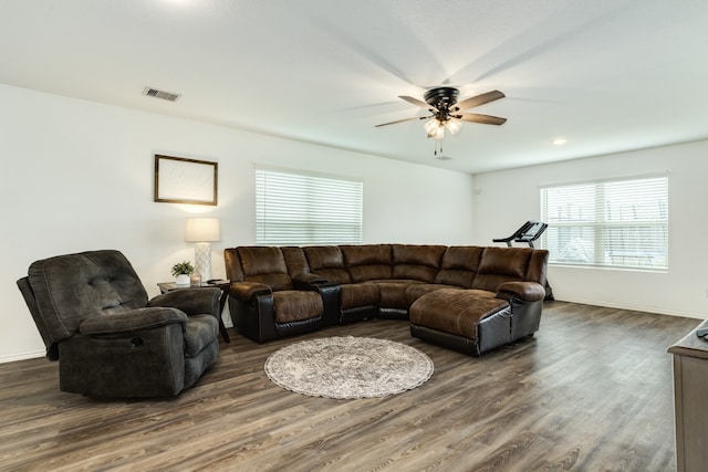 living room with ceiling fan and dark hardwood / wood-style floors