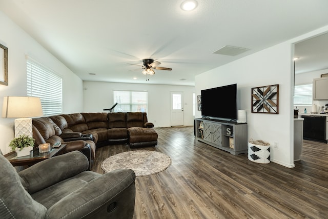 living room with ceiling fan and dark hardwood / wood-style floors