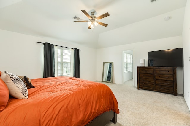 carpeted bedroom featuring vaulted ceiling and ceiling fan