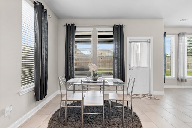 dining space with light tile patterned floors