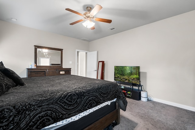 bedroom with ceiling fan and carpet floors