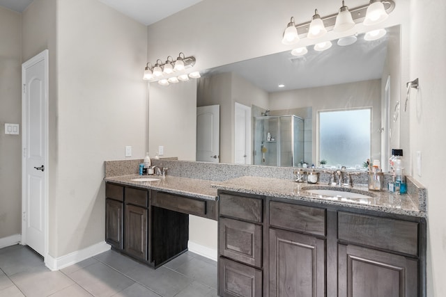 bathroom with vanity, walk in shower, and tile patterned floors