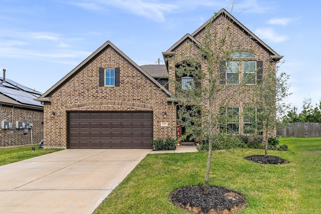 front of property featuring a garage and a front yard