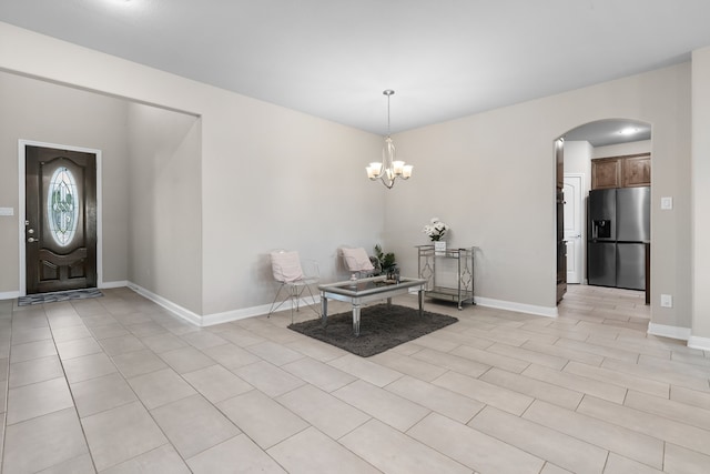 entrance foyer with an inviting chandelier