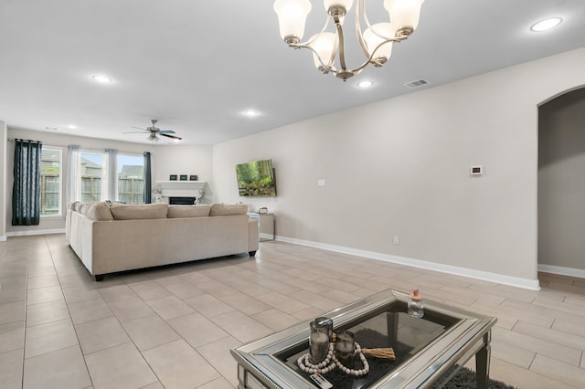 kitchen featuring hanging light fixtures and ceiling fan with notable chandelier