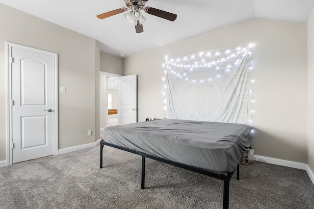 carpeted bedroom with ceiling fan and vaulted ceiling