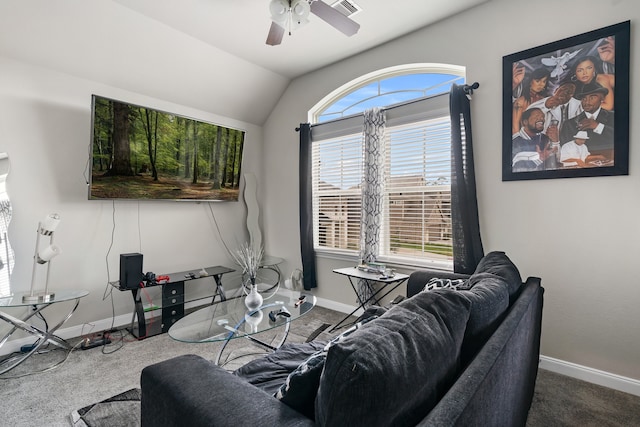 carpeted living room with ceiling fan and vaulted ceiling