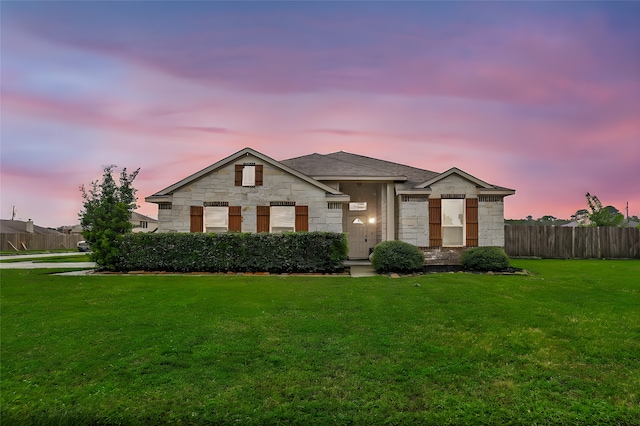 view of front of house with a yard